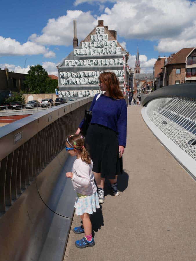 me and our daughter looking towards the water on the Buda Bridge, one of Kortrijk things to do