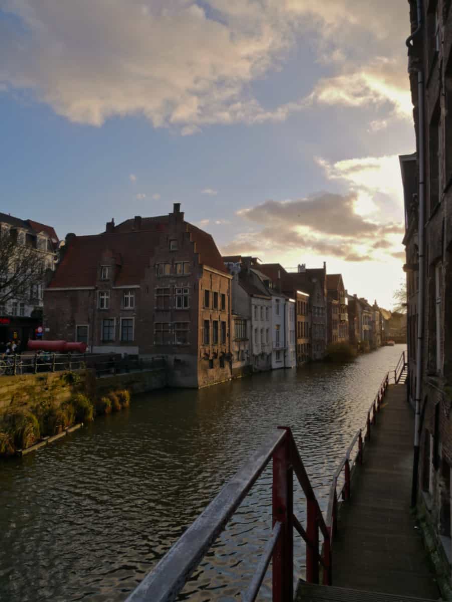 Photo of a sun-kissed Leie river in Ghent.