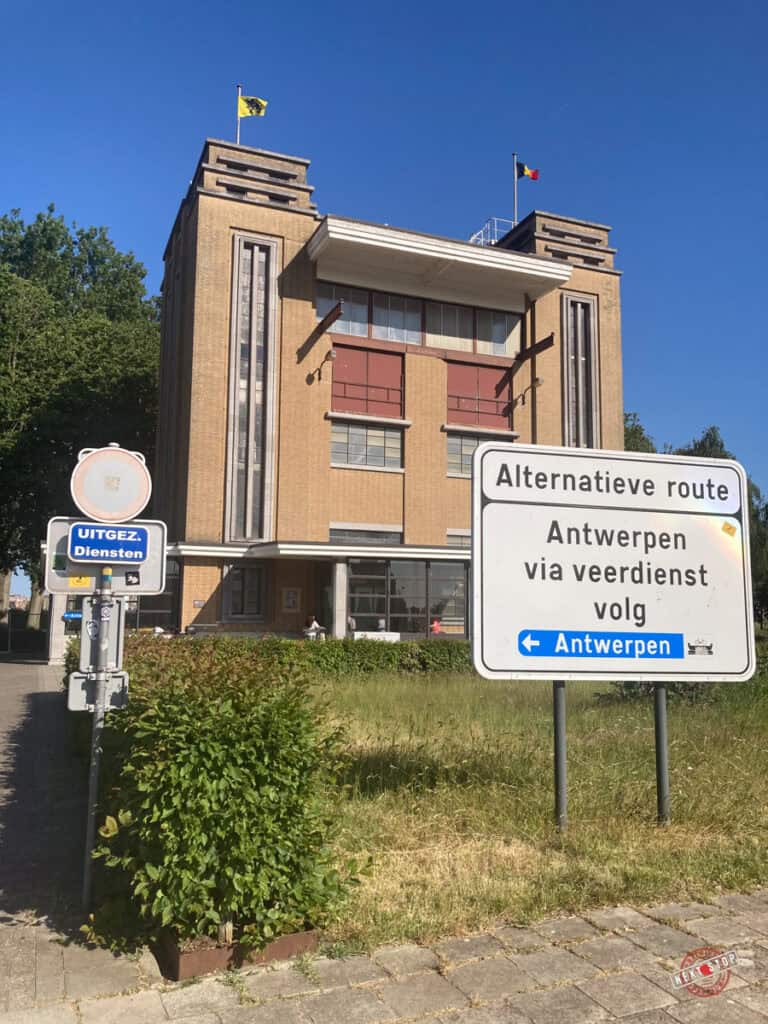 a building and signage of St Annal tunnel in Antwerp Linkeroever