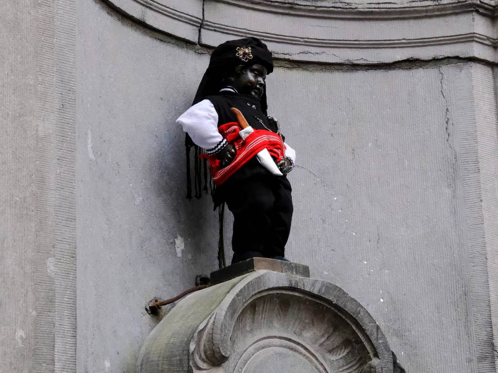 mannekin pis in a new costume, one of the amazing belgium facts