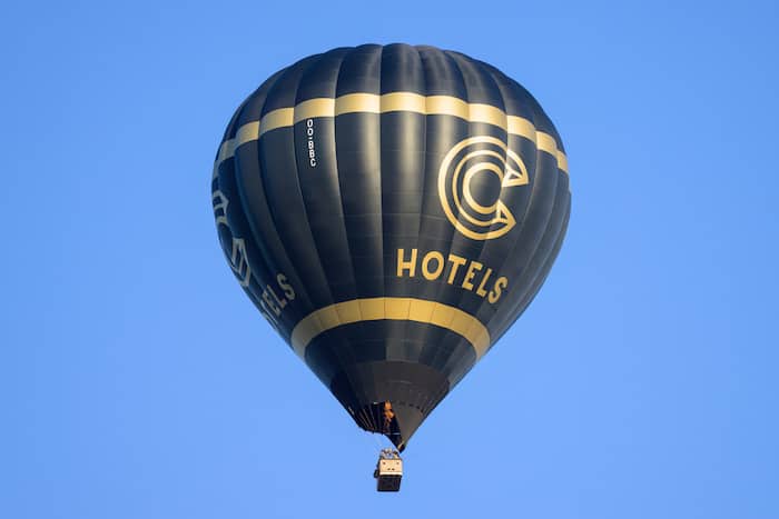 Hot air balloon in Bruges with a big print of C Hotels.