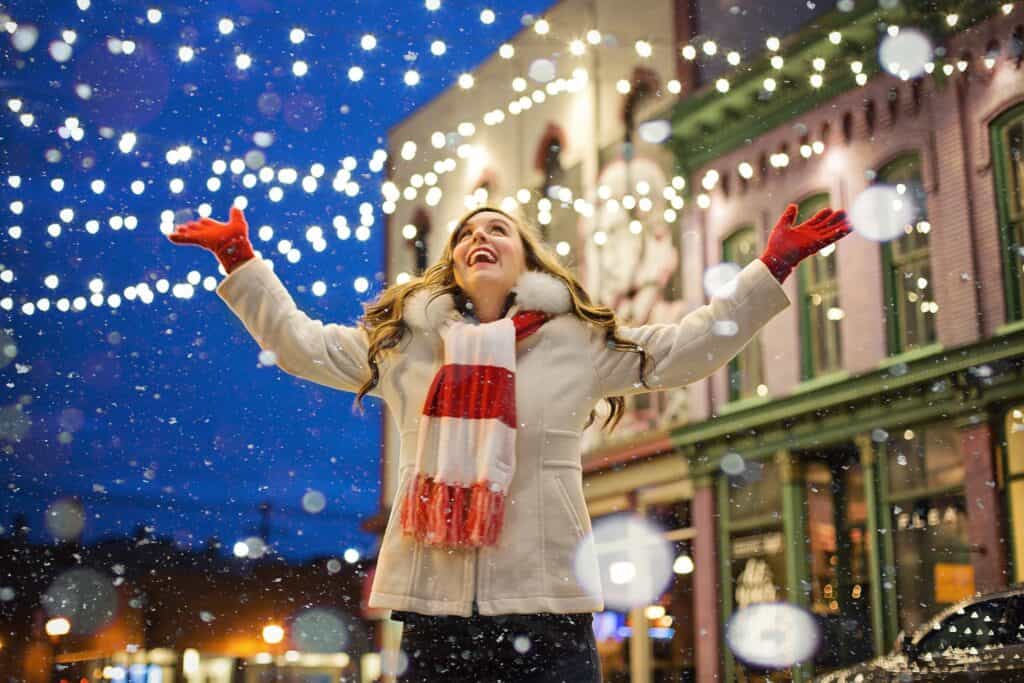 woman smiling on Christmas Snow