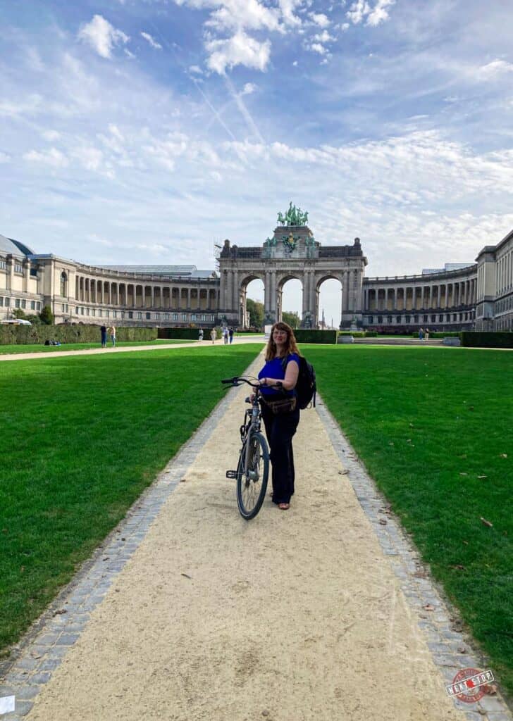 Babs with bicycle in the Parc du Cinquantenaire, Brussels.