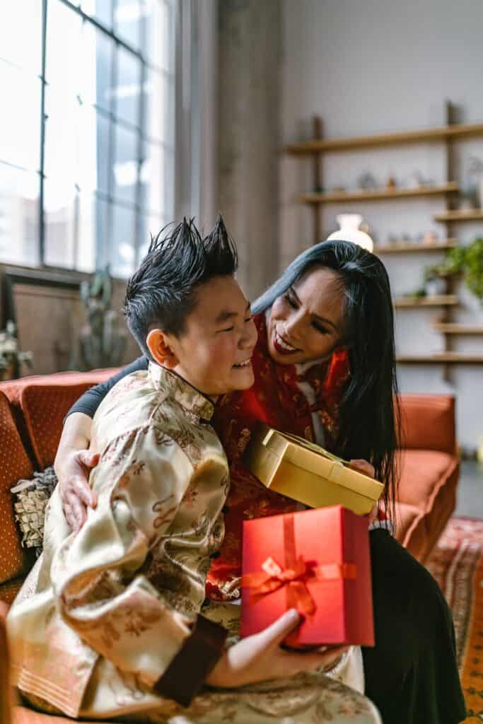 mother giving gift to child