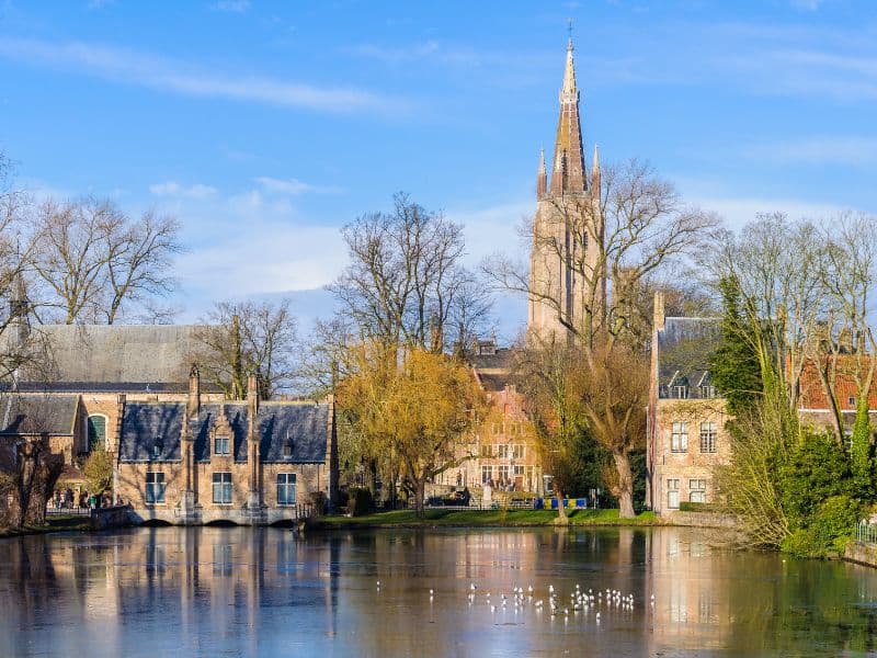 The calm Minnewater Lake in Bruges, Belgium