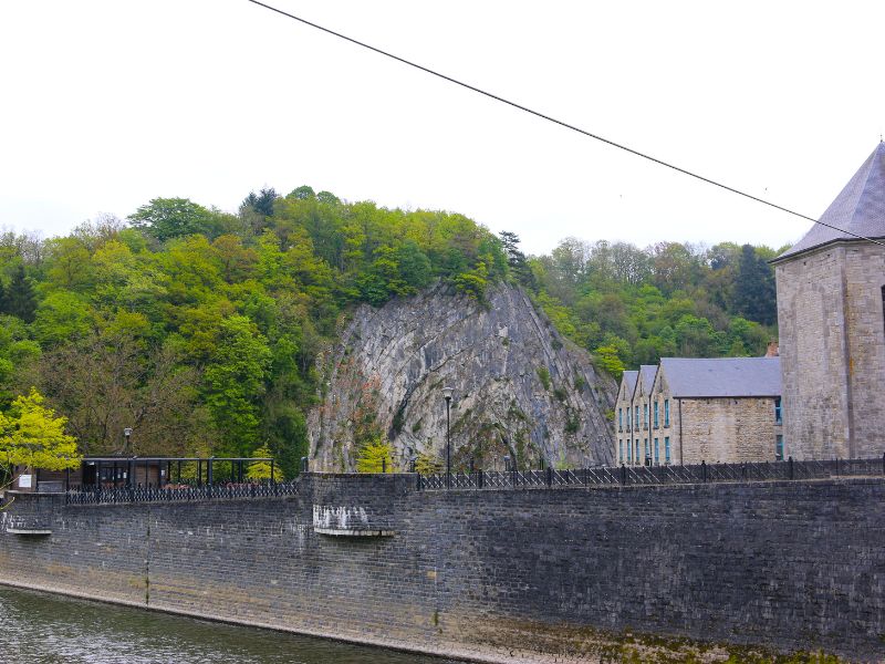 Homelius rock seen from the river with old houses on the right side