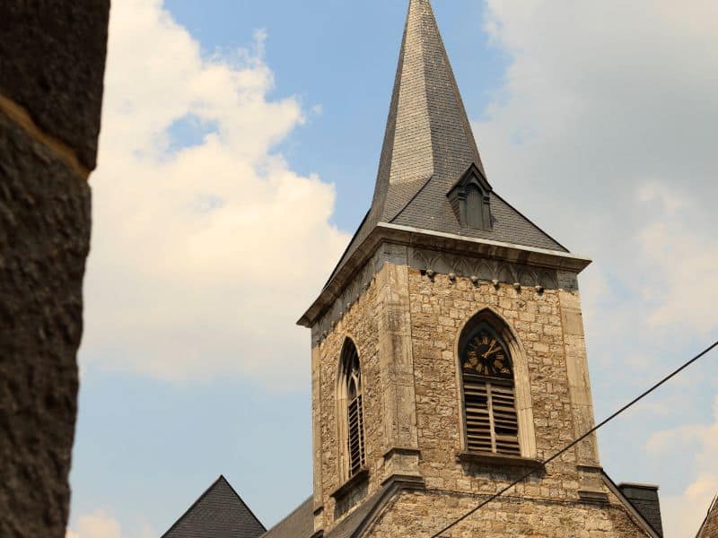 Clock tower of st nicholas church in durbuy