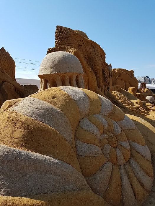 A close-up image of sand sculptures