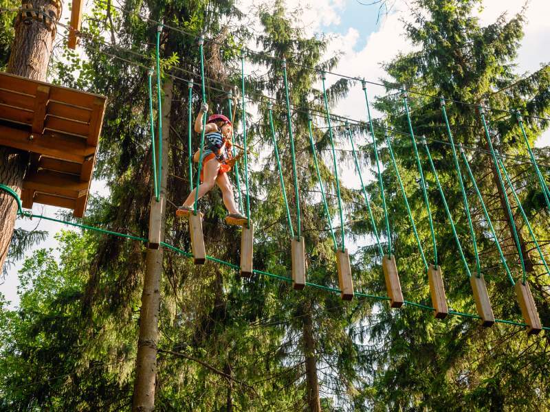 Girl on a treetop - best things to do in Brussels with kids.