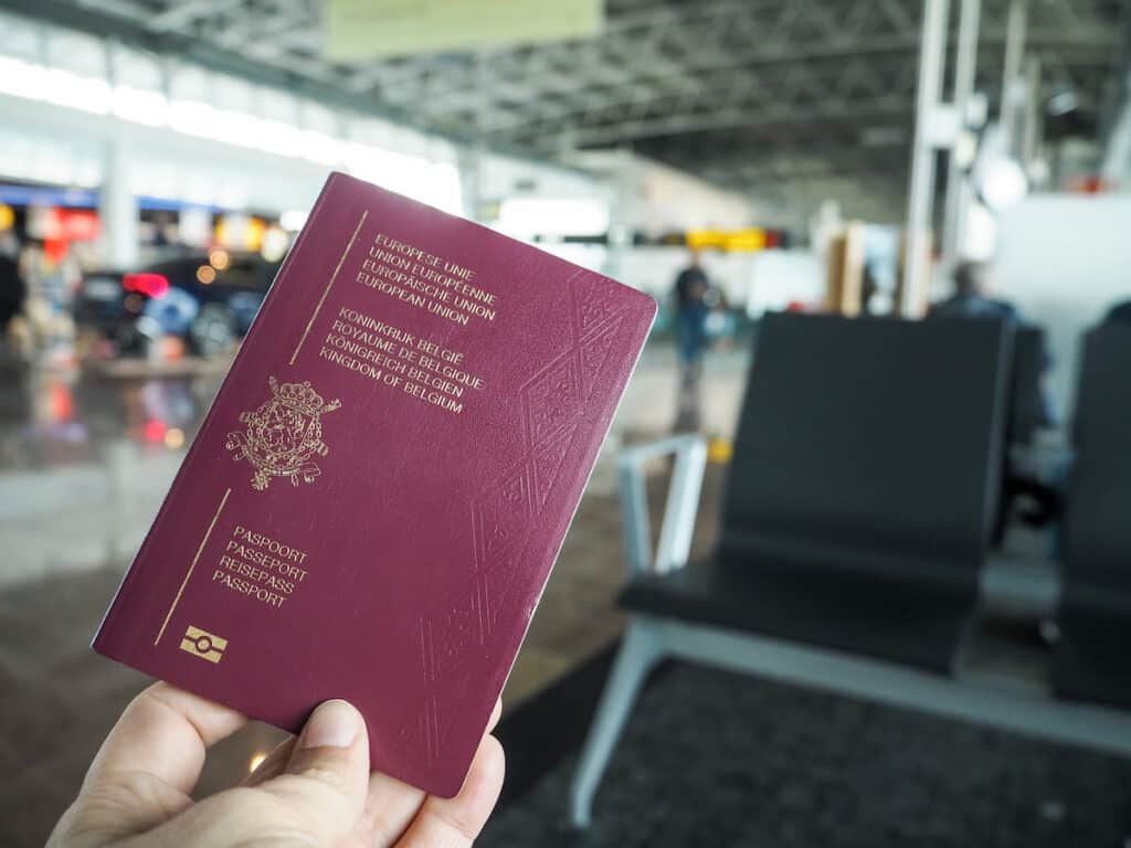 A person holding his passport in the Brussels Airport - one of the main airports in Belgium.