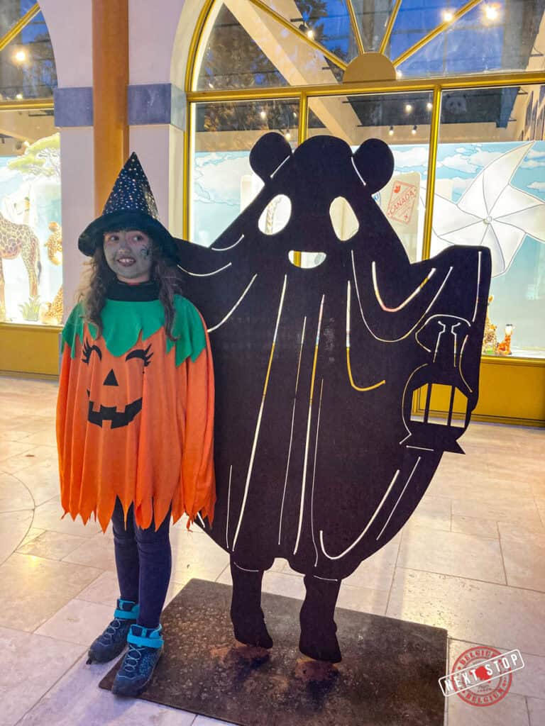 a girl dressed up with a pairi daiza panda ghost statue