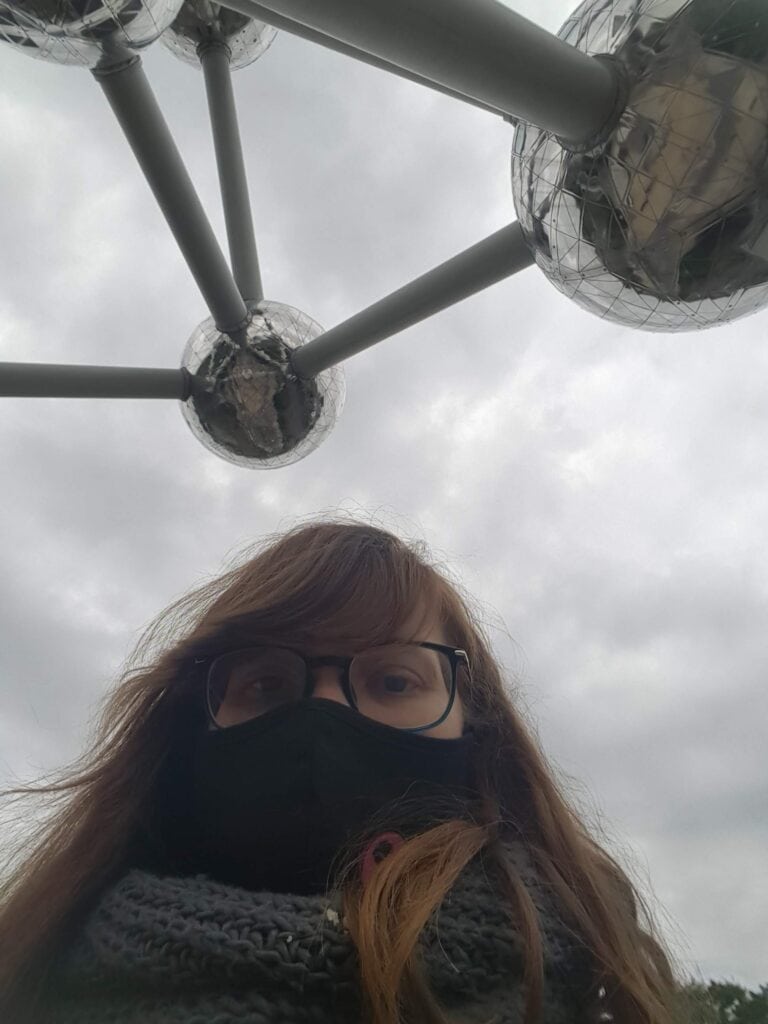 Selfie taken from underneath (with facemask) seeing the silver balls of the Atomium.
