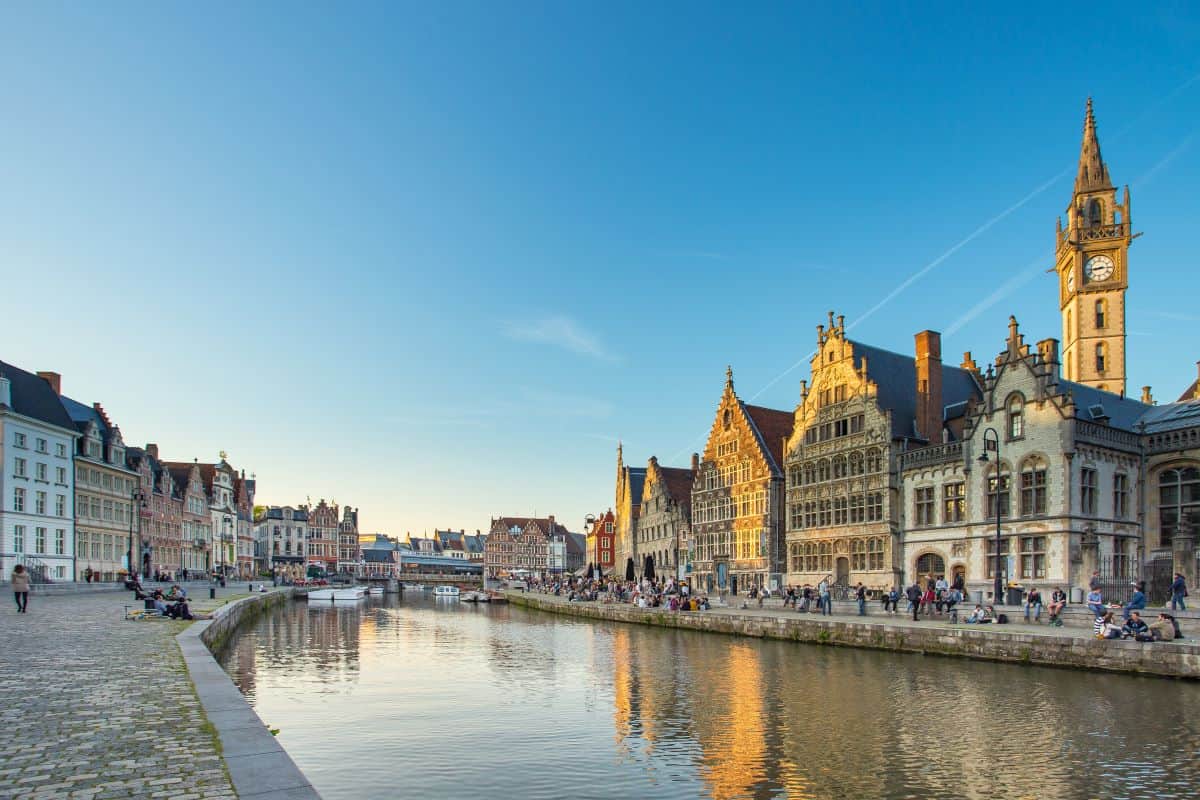 Leie River running past the Gras and Korenlei in Ghent with historical buildings on the right.