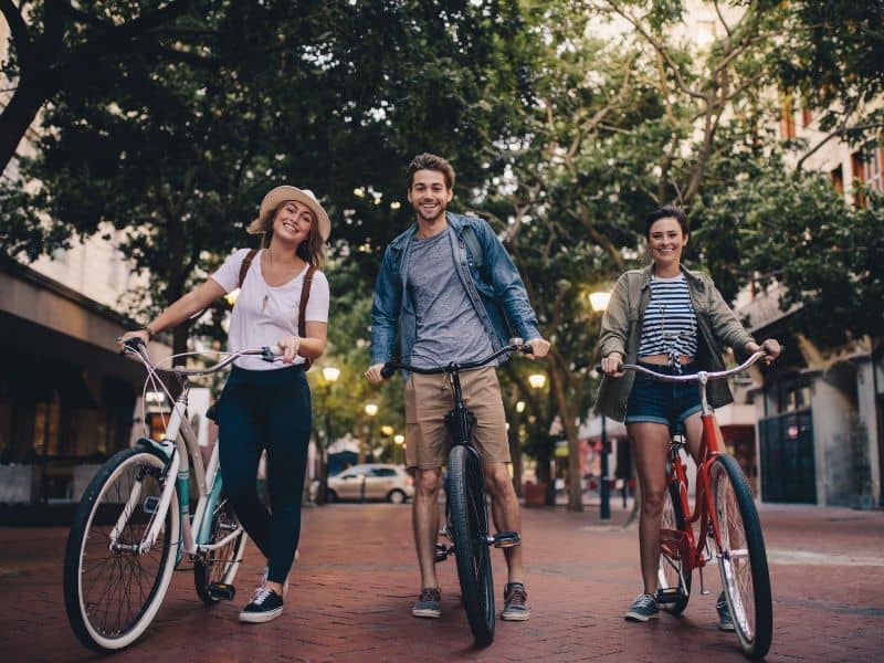 Young people touring the city on bikes.