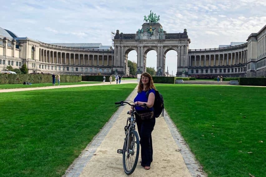 Babs with bicycle in the Parc du Cinquantenaire, Brussels.