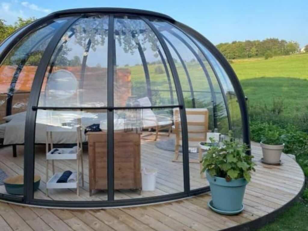 transparent bubble-shaped accommodation nestled in a serene natural setting