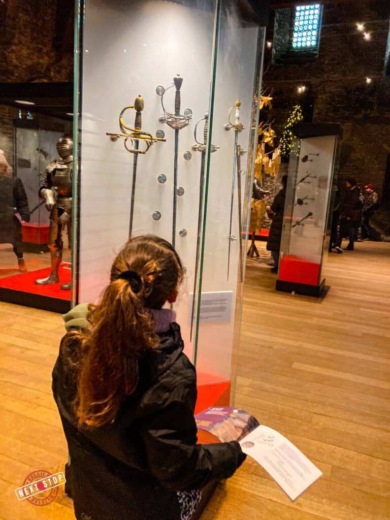 My daughter looking at the swords at Gravensteen Castle.