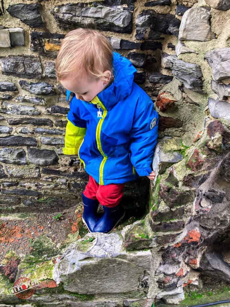 My toddler playing on the ramparts of the Castle of the Counts.