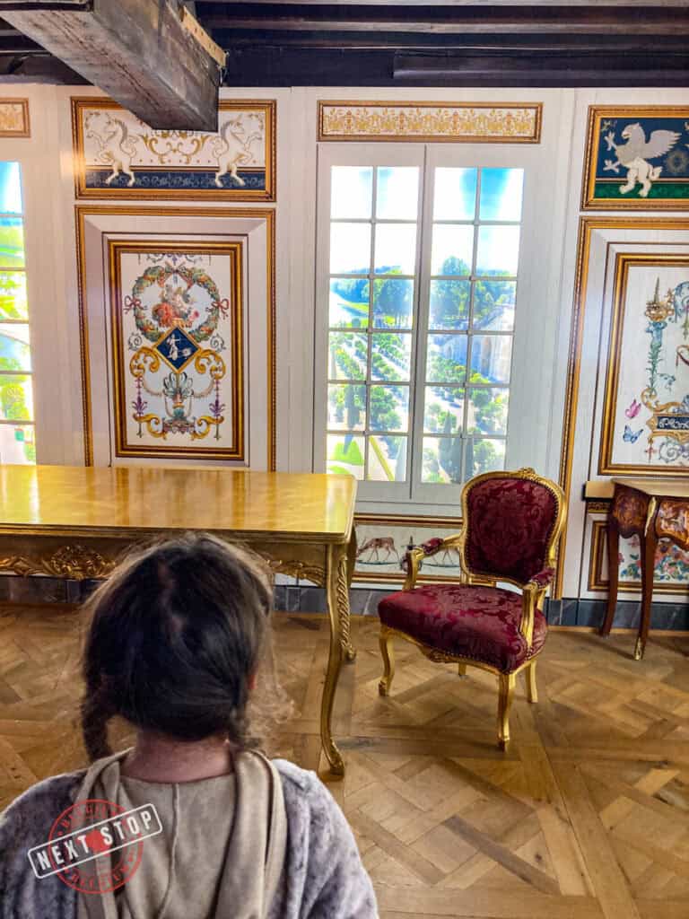 My daughter looking at the paintings at Choco Story Museum.