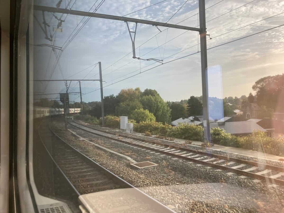 Image taken from inside the train looking through the window towards the tracks and the end of the train.