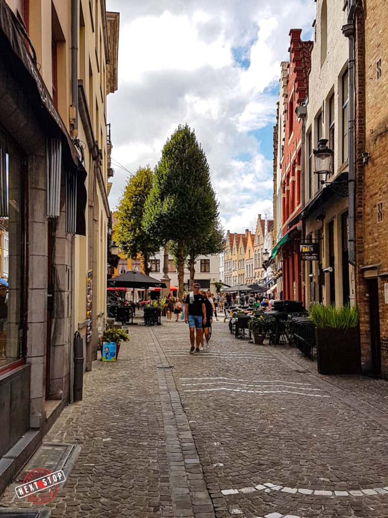 People walking on a street in Bruges.