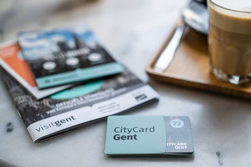 Ghent city card on a table near the coffee.