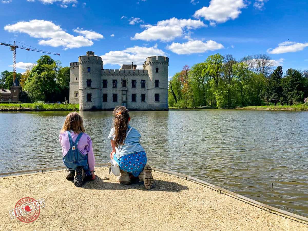 My daughter and niece are looking at the castle across the lake at the Botanical Garden in Maise.