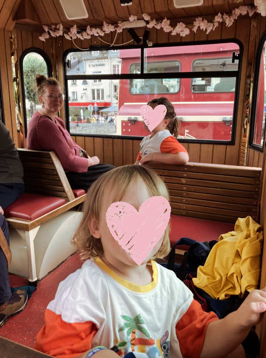 Babs, Norah and Oscar inside Le Petit Train in Bouillon.
